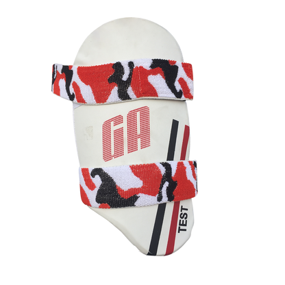 White GA branded thigh guard with red and black camouflage pattern on the straps.